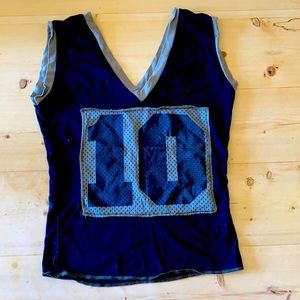 V-Neck sleeveless number ten tee. Junior size